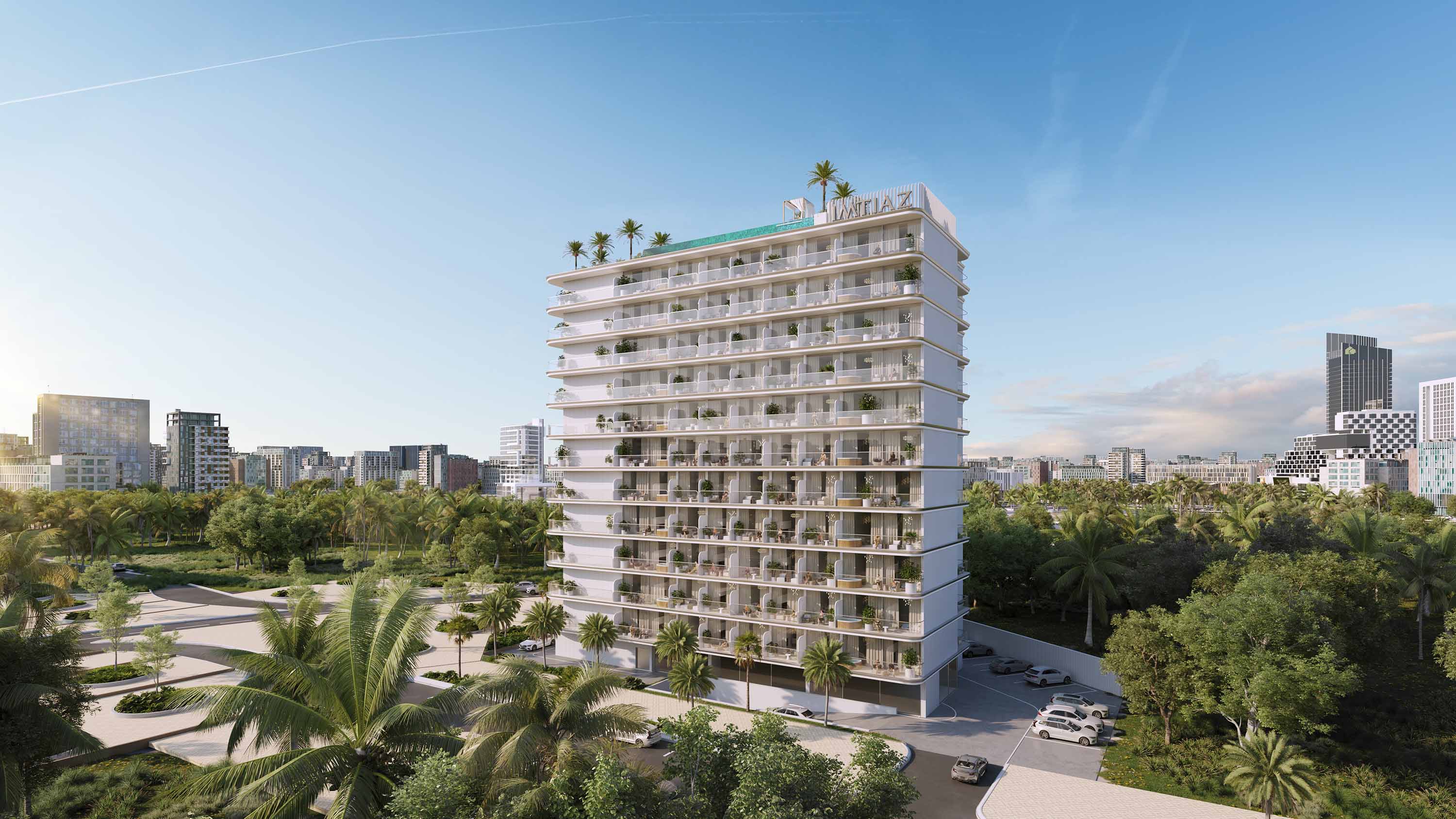 Cove Edition 5 By Imtiaz A modern multi-story building surrounded by palm trees, with a city skyline in the background and blue sky above.